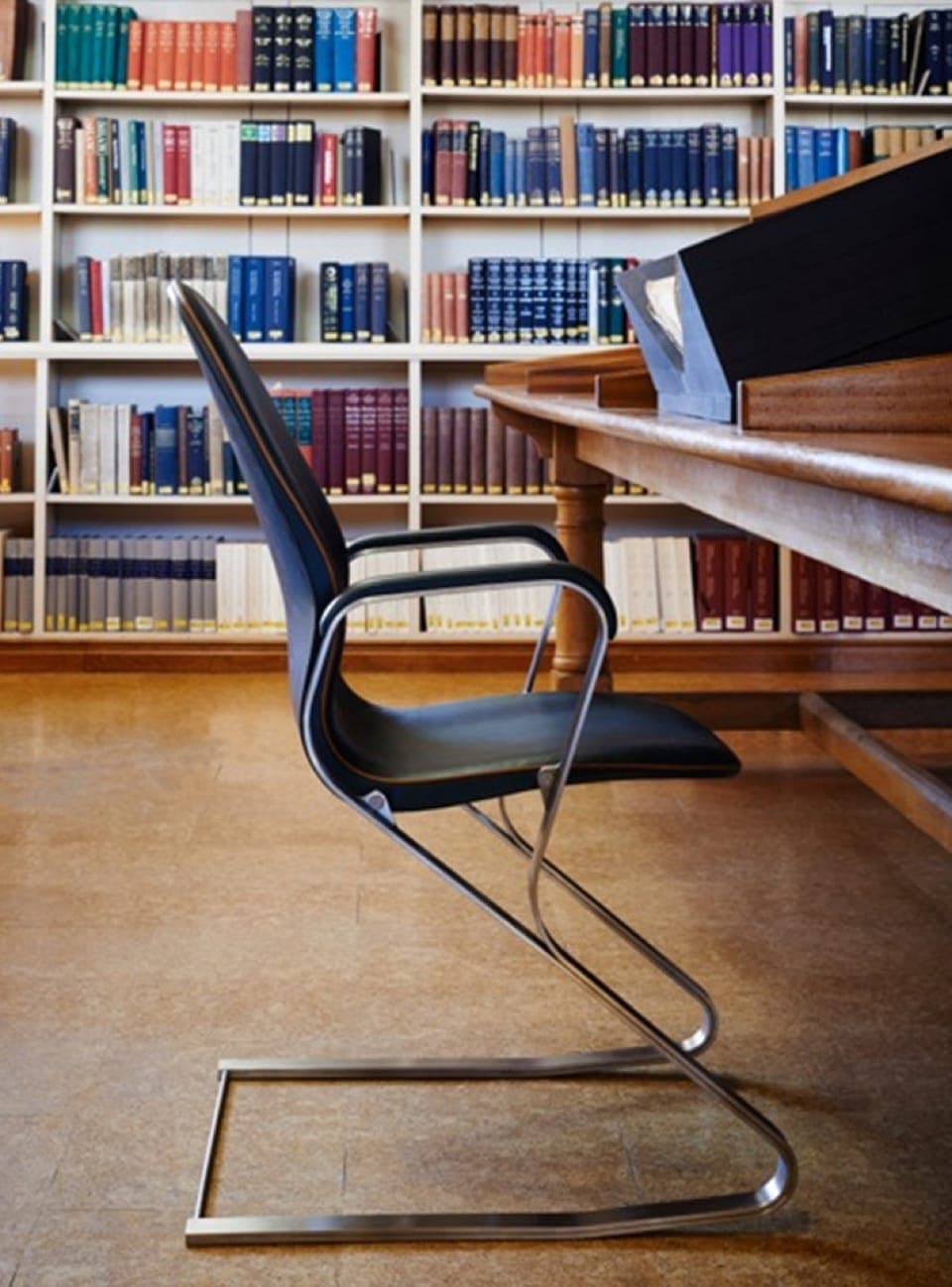 Shaped steel chair in library
